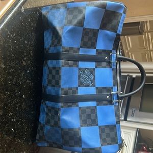 I’m selling a vintage(but never used) Louis Vuitton Keepall Bag
